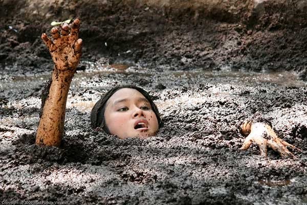 man stuck in quicksand
